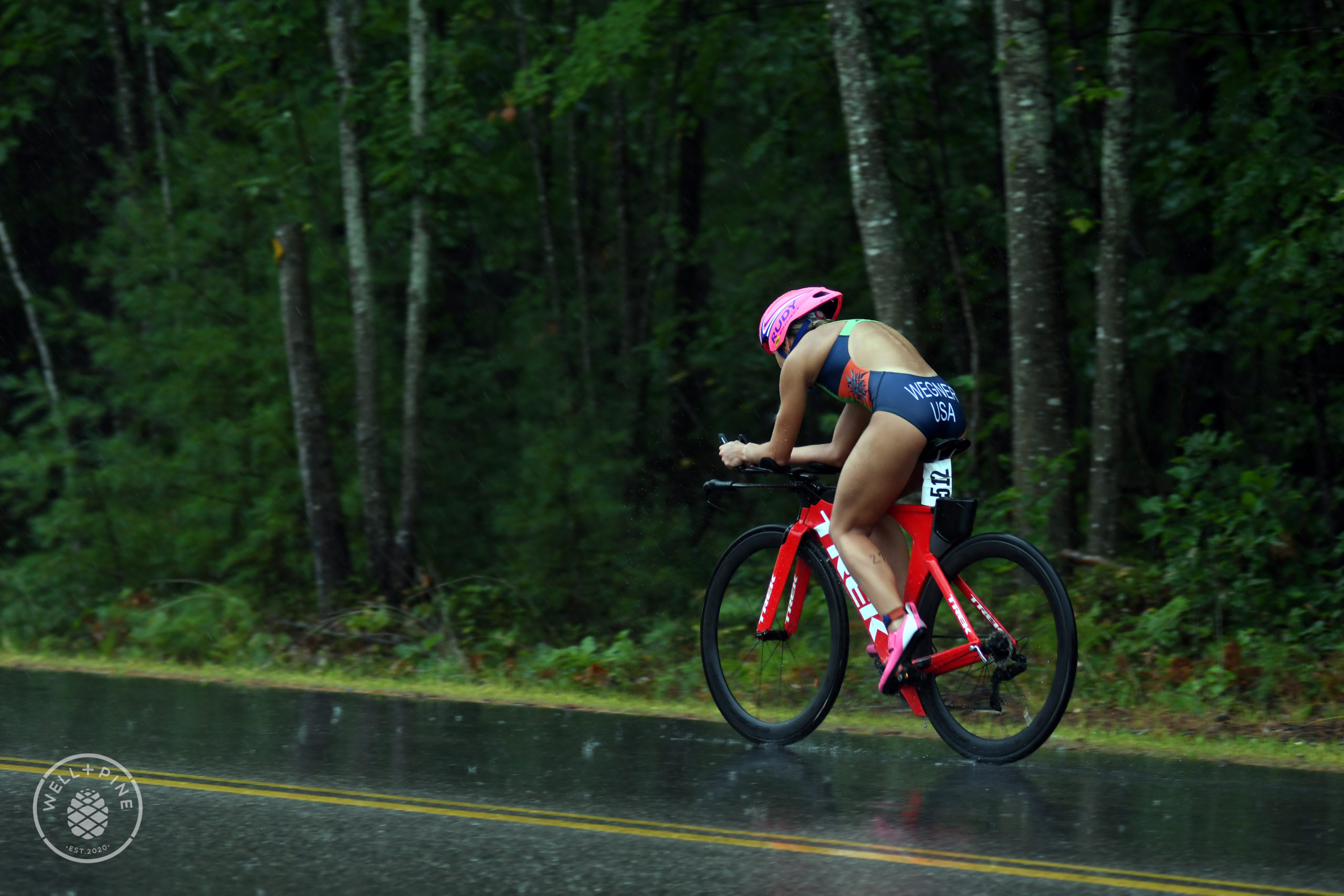 a triathlete racing in the rain